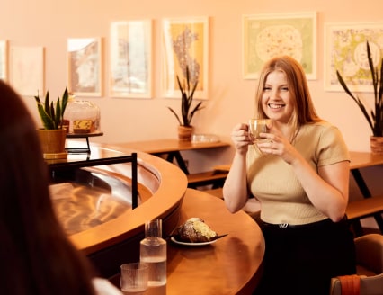 People drinking water in an office